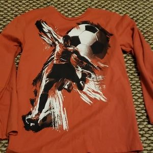 Children place boys shirt